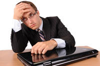 Business man looking stressed about his laptop